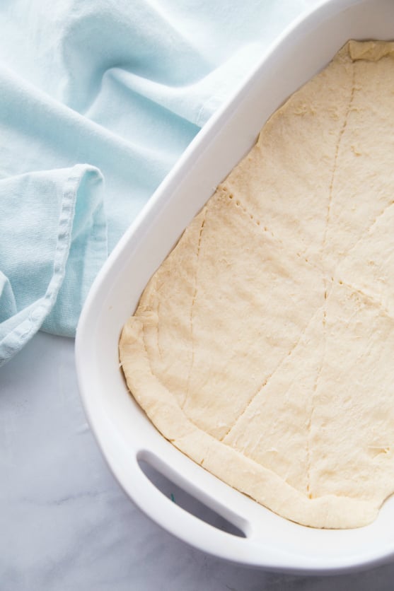 Churro Cheesecake Bars - Crescent dough at bottom of baking dish - Family Fresh Meals