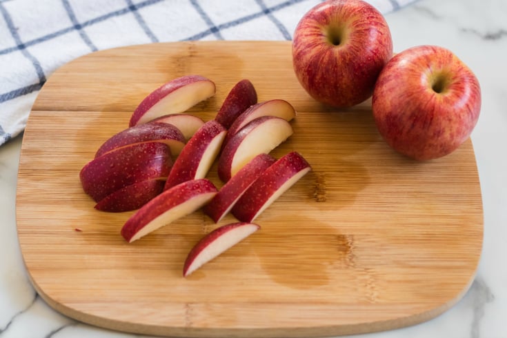 Cucumber Ham Cheese Kabobs - Apple slices on cutting board - Family Fresh Meals