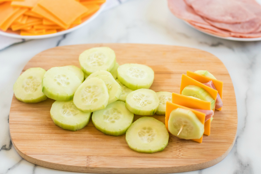 Cucumber Ham Cheese Kabobs - Cucumber slices on cutting board - Family Fresh Meals