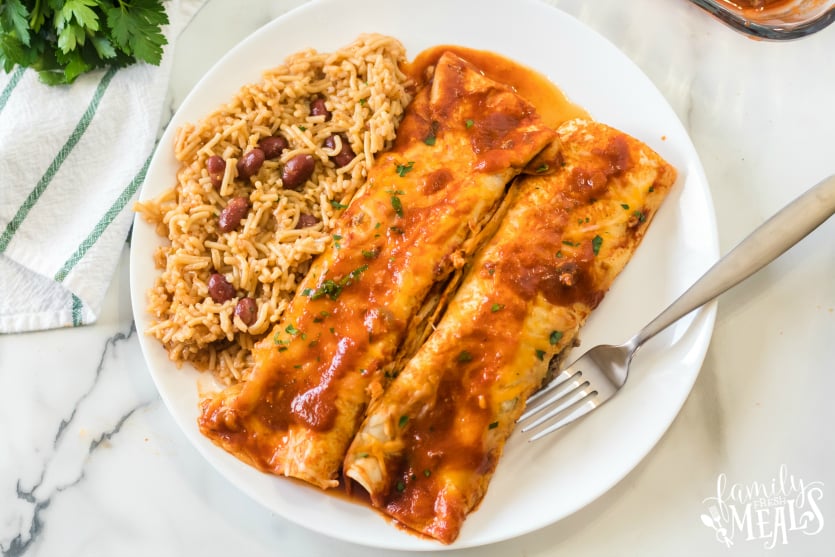 Easy Beef Enchiladas - served on a white plate - Family Fresh Meals