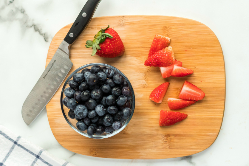 Easy Lunchbox Idea Bagels packed for lunch _ fresh berries on cutting board - Family Fresh Meals