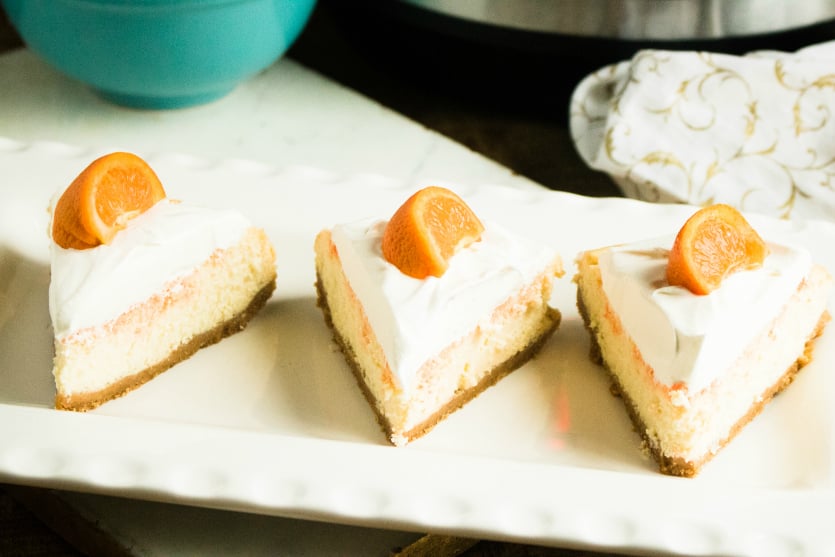 Instant Pot Orange Creamsicle Cheesecake - Slices of cheesecake on a white plate