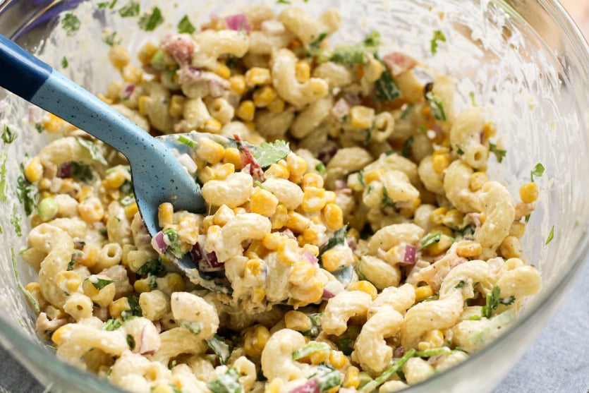 Mexican Street Corn Pasta Salad - pasta salad mixed together in a large mixing bowl