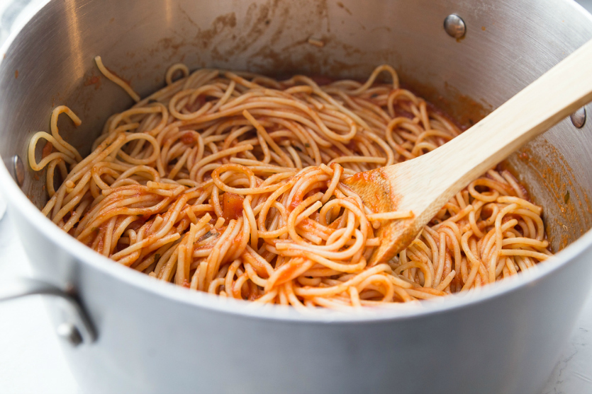 Million Dollar Baked Spaghetti - pasta and sauce mixed together in large cooking pot