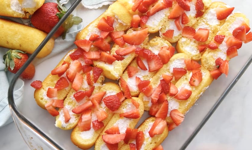 No Bake Strawberry Twinkie Cake - Sprinkle sliced strawberries on top of twinkies