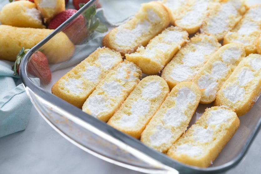 No Bake Strawberry Twinkie Cake - Twinkie halves in baking pan