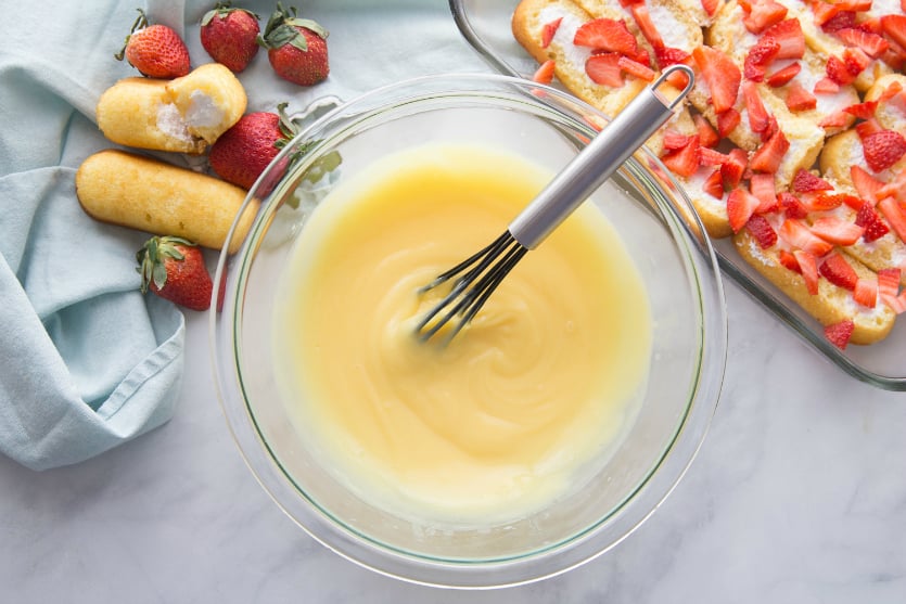 No Bake Strawberry Twinkie Cake - pudding mixture in a glass bowl