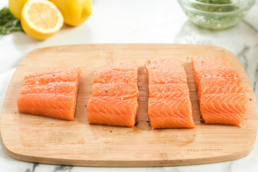 Asparagus Salmon Foil Packets - Sliced salmon on cutting board