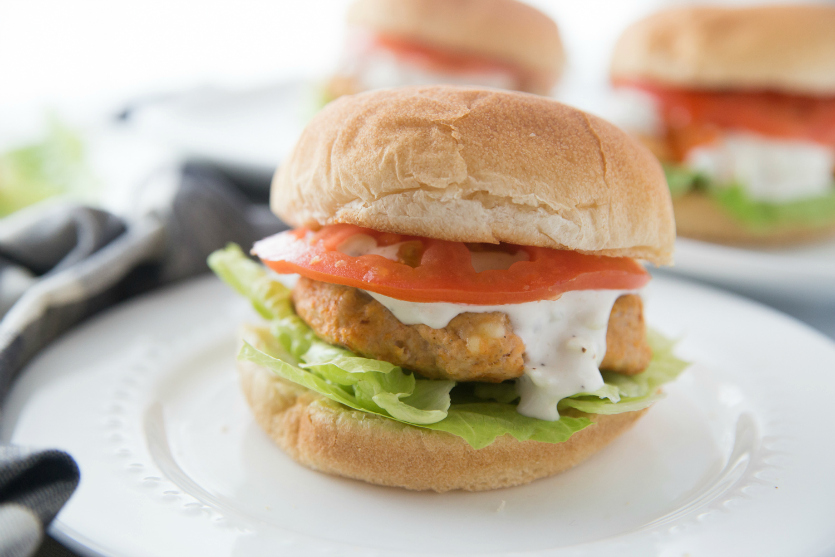 Buffalo Chicken Burgers - Buffalo Chicken burger served on a white plate