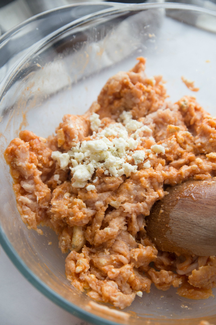 Buffalo Chicken Burgers - ground chicken and cheese and hot sauce mixed together in a bowl