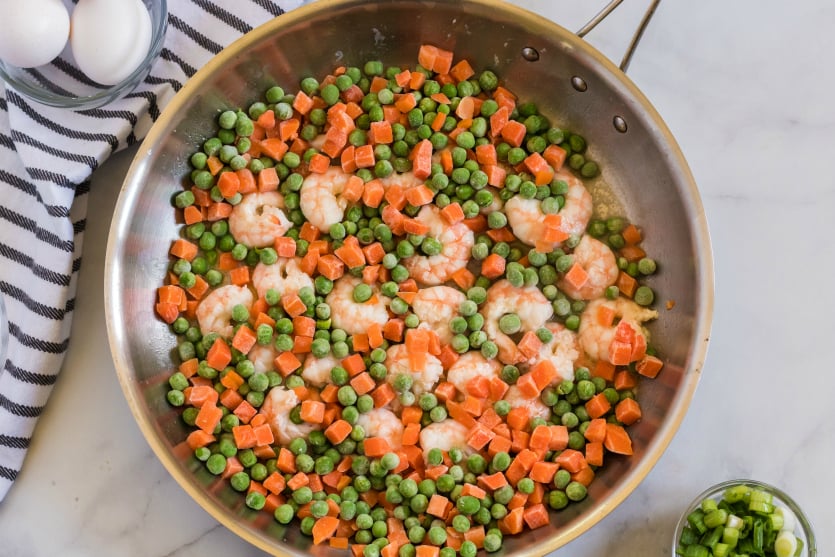 Easy Shrimp Fried Rice - frozen veggies added to the pan with shrimp - Family Fresh Meals