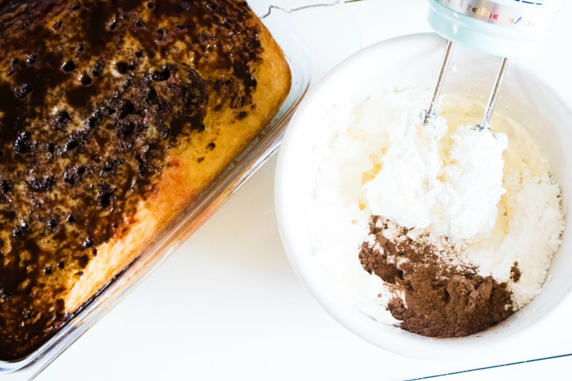 Banana Split Poke Cake - mixing whipped frosting