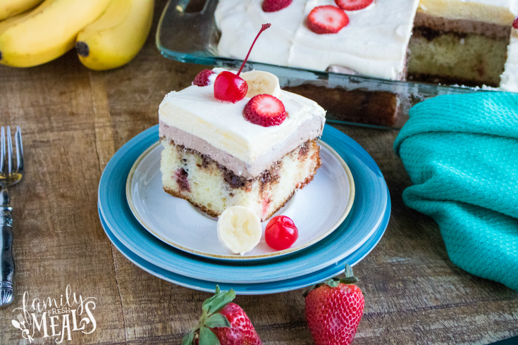 Banana Split Poke Cake - slice of cake served on a plate