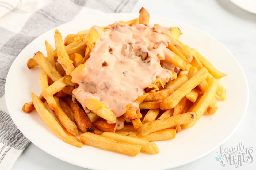 Copycat In N Out Animal Fries - Served on a white plate