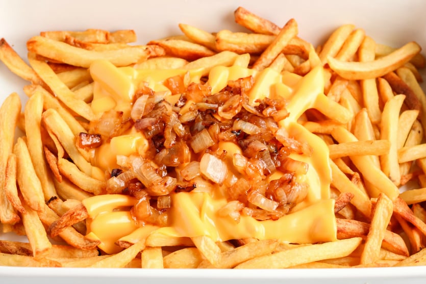 Copycat In N Out Animal Fries - sauteed onions placed on top of melted cheese