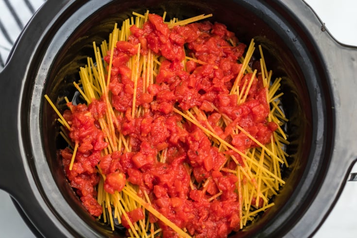 Crockpot Spaghetti and Meatballs - Diced tomatoes poured on top of noodles