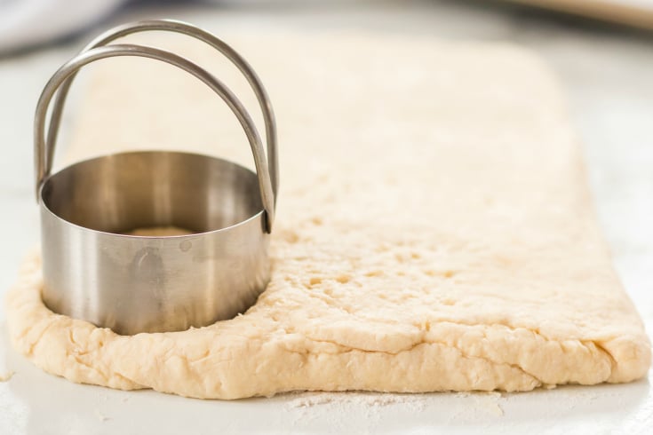 Easy Homemade Biscuits - circle biscuit cutter pushed in to dough