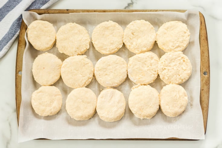 Easy Homemade Biscuits - cut biscuit dough on parchment paper lined baking sheet