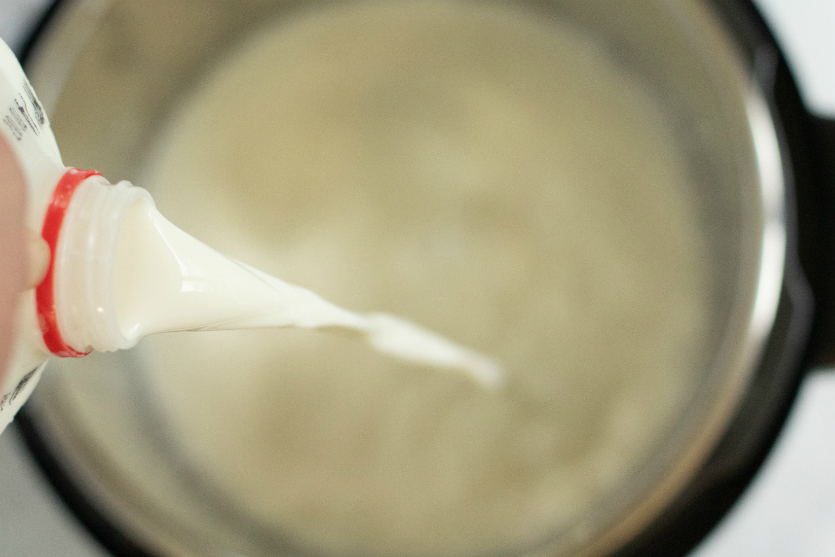 How to make Yogurt in the Instant Pot - pouring milk into the instant pot