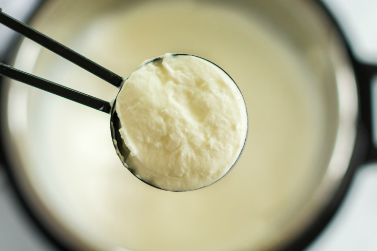How to make Yogurt in the Instant Pot - spoon full of yogurt