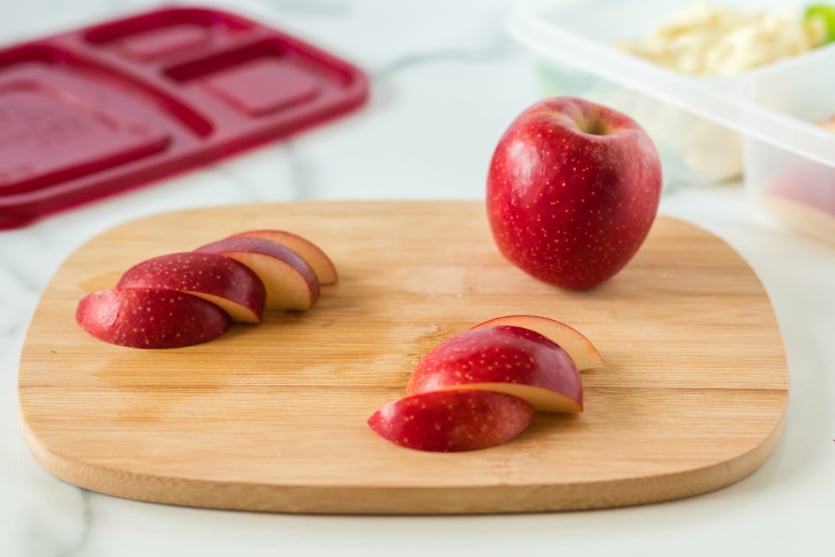 Pasta Salad Packed for lunch - Sliced apples on a cutting board