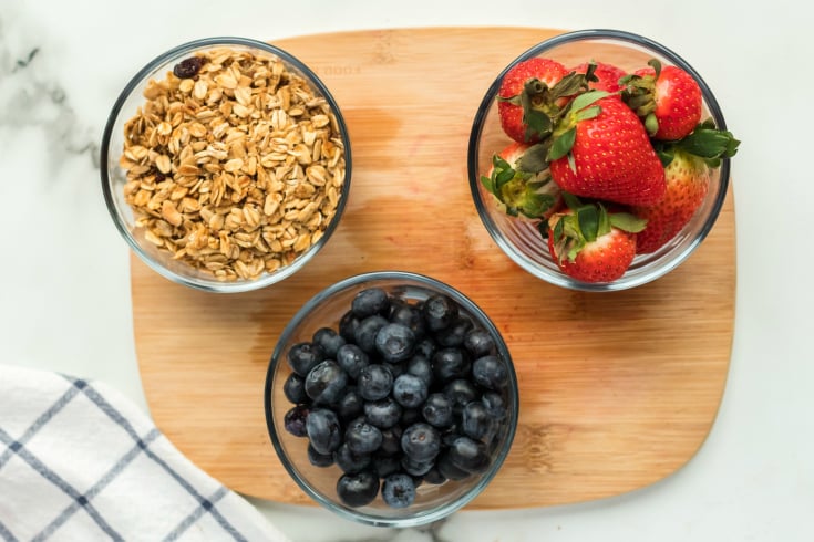 Yogurt Parfait Snack Box - blueberries, strawberries and granola in small bowls