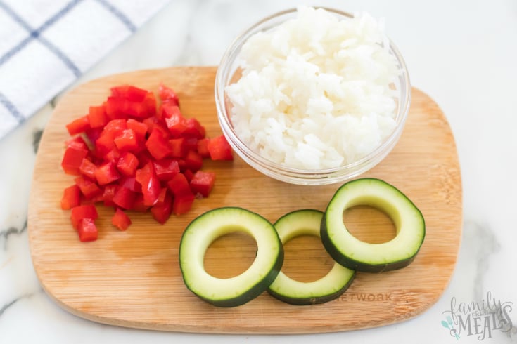 Cucumber Sushi Lunch Box Idea - cucumbers, rice and diced peppers
