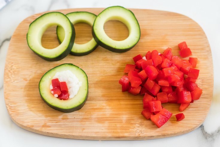 Cucumber Sushi Lunch Box Idea - showing how to make cucumber sushi on cutting board