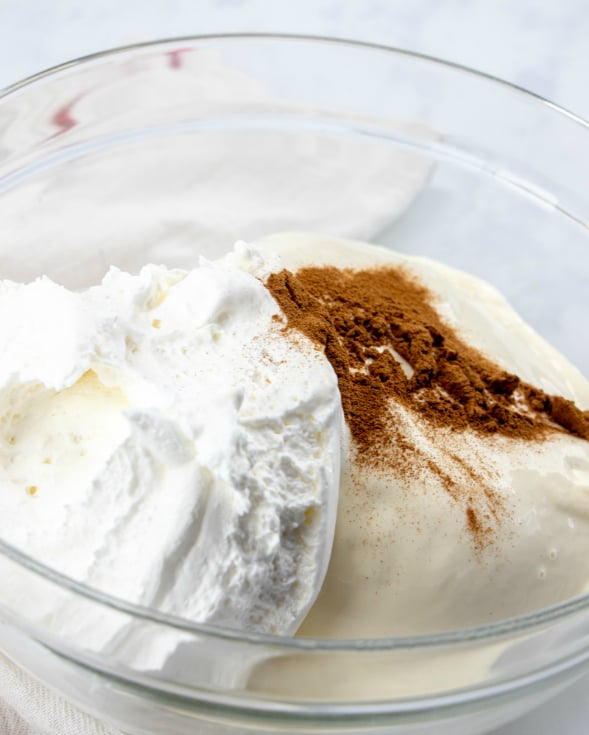 Fried Ice Cream Cake - ice cream, cinnamon and whipped topping in glass bowl