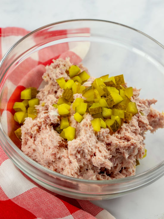 Classic Ham Salad Recipe - chopped pickles adding into ham salad