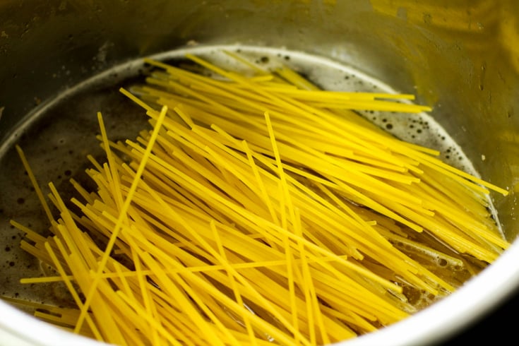 Instant Pot Bang Bang Shrimp Pasta - dried pasta water and oil in instant pot