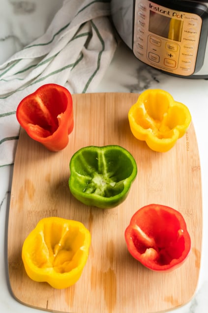 Instant Pot Stuffed Peppers - Raw peppers, seeded on a cutting board