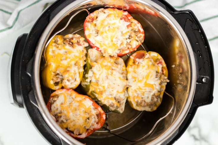 Instant Pot Stuffed Peppers - cheese melted on to of stuffed peppers