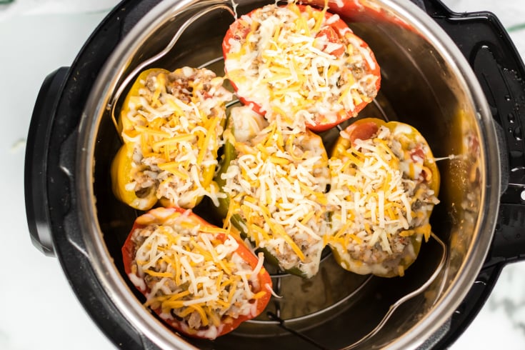 Instant Pot Stuffed Peppers - shredded cheese placed on top of cooked stuffed peppers