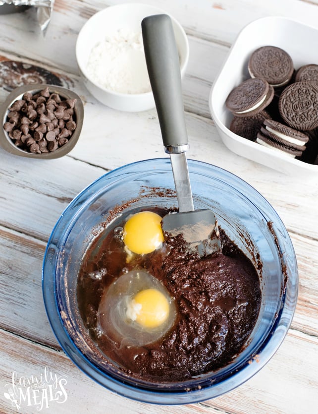 Oreo Stuffed Brownies - brownie ingredients being mixed in a glass mixing bowl.
