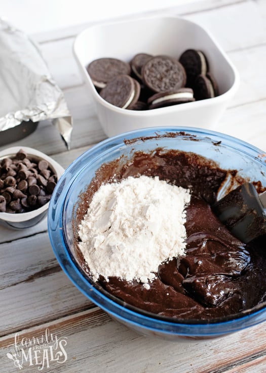 Oreo Stuffed Brownies - flour being mixed in to brownie mix