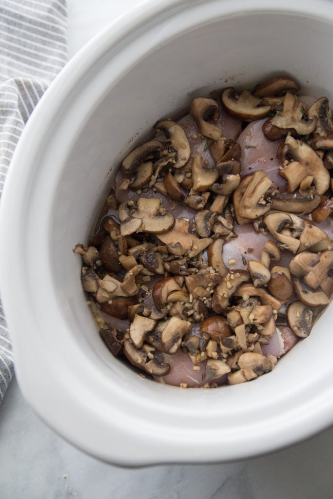 Crockpot Chicken Marsala - mushrooms on top of chicken in crockpot