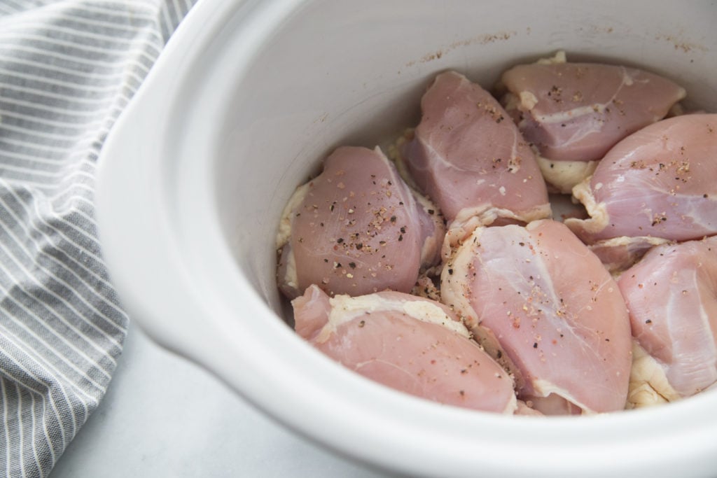 Crockpot Chicken Marsala - Chicken thighs in bottom of slow cooker