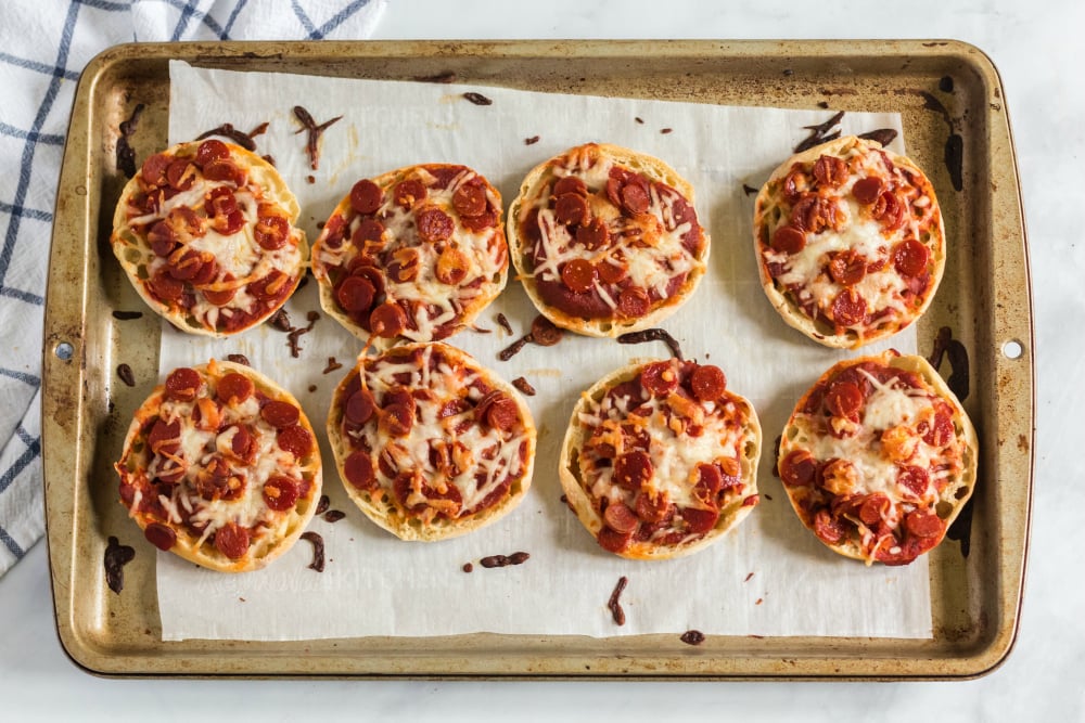 English Muffin Pizza Lunchbox Idea - cooked English muffin pizzas on baking sheet