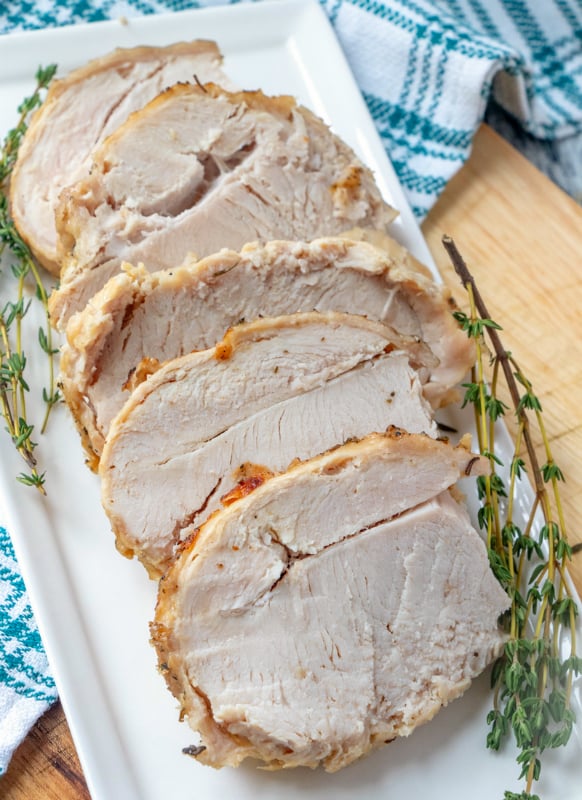 Instant Pot Turkey Breast - turkey breast sliced on a white plate