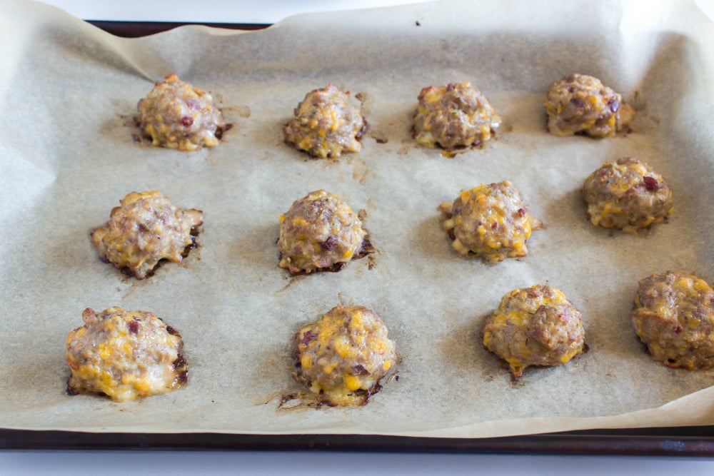 Sausage Stuffing Bites Recipe - cooked sausage balls on baking sheet