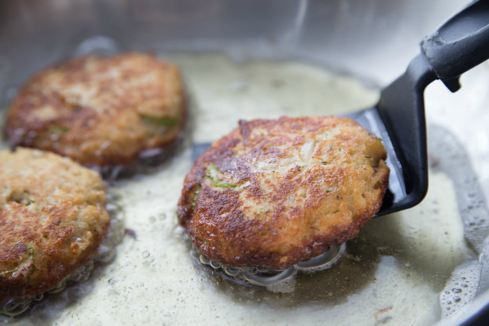 Easy Crab Cakes - crab patties cooking in pan