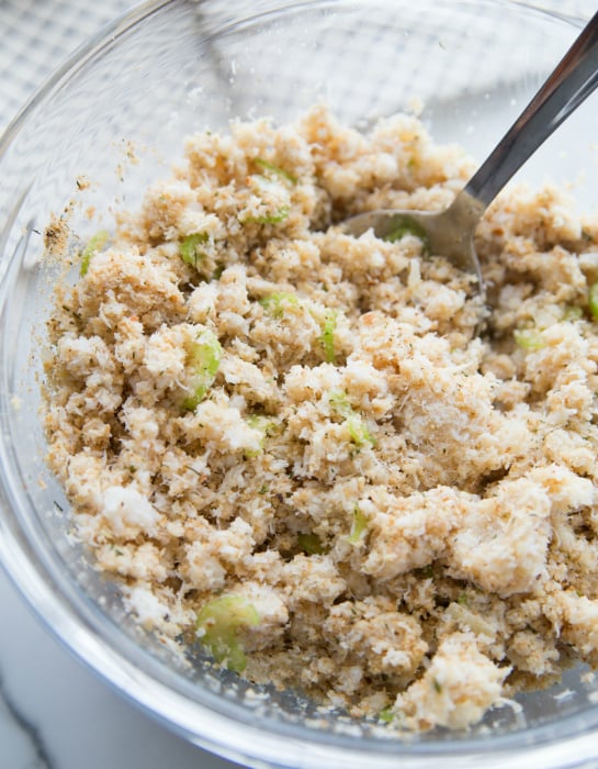 Easy Crab Cakes - mixing crab in a glass mixing bowl