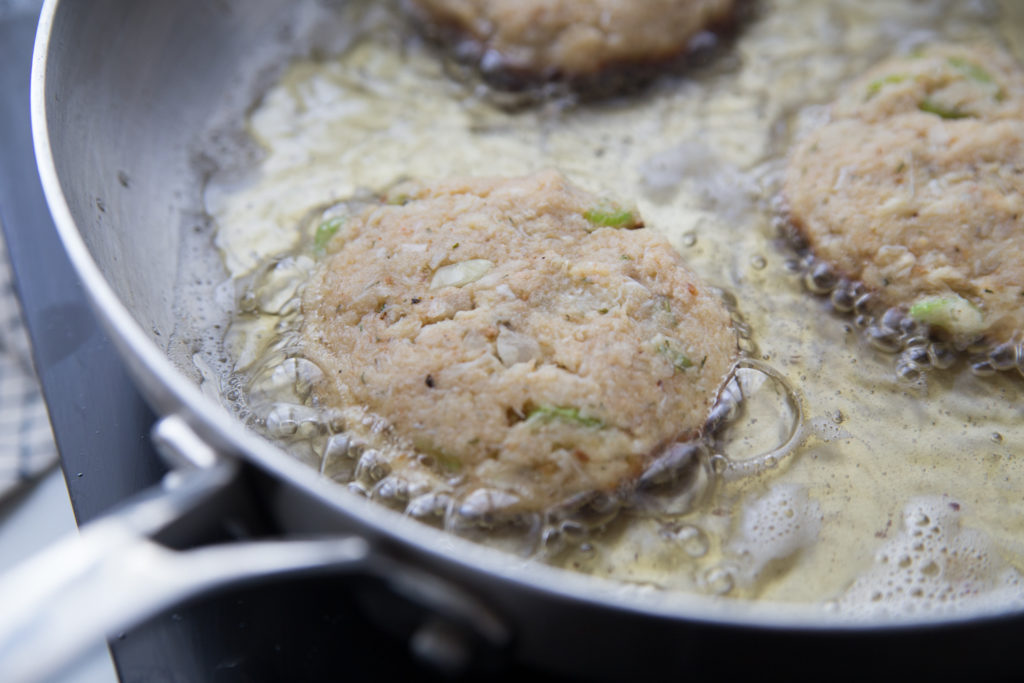Easy Crab Cakes- patties cooking in a pan