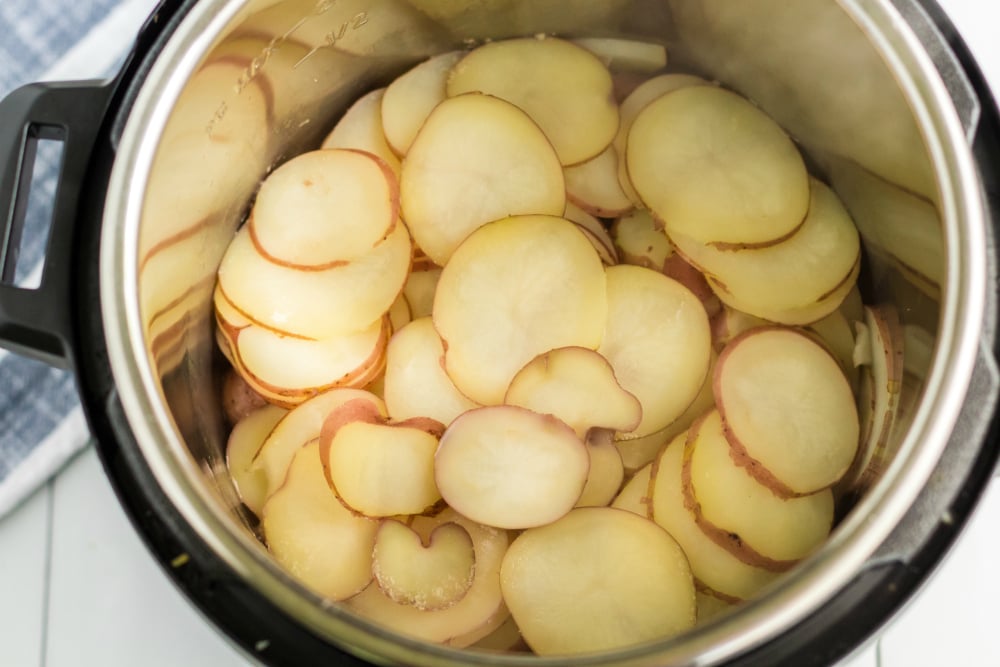 Instant Pot Scalloped Potatoes - cooked sliced potatoes in pressure cooker