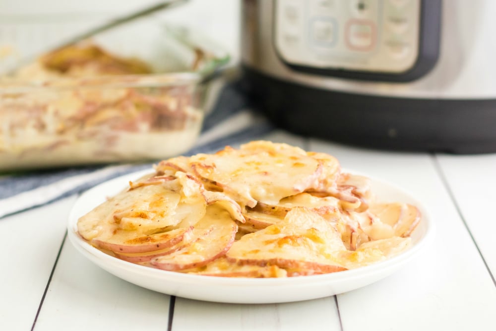 Instant Pot Scalloped Potatoes - served on a white plate
