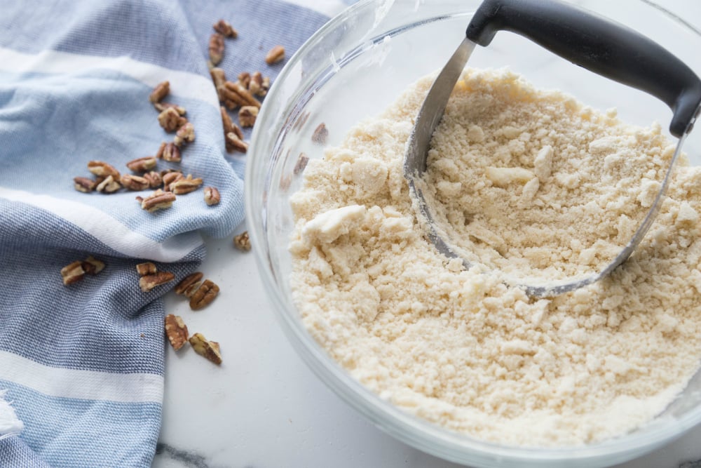 Pecan Pie Bars - cutting in butter and flour