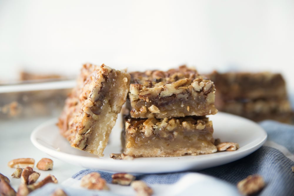 Pecan Pie Bars - served on a white plate