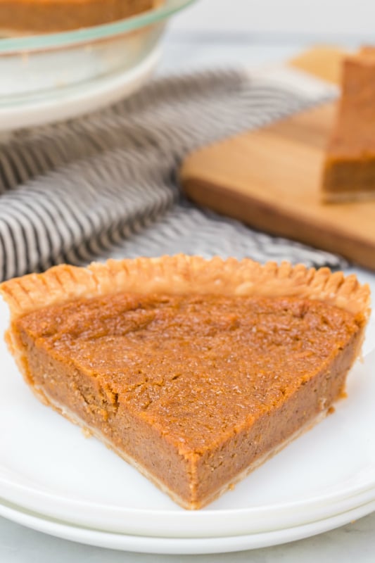 Sweet Potato Pie - Slice of pie served on a white plate