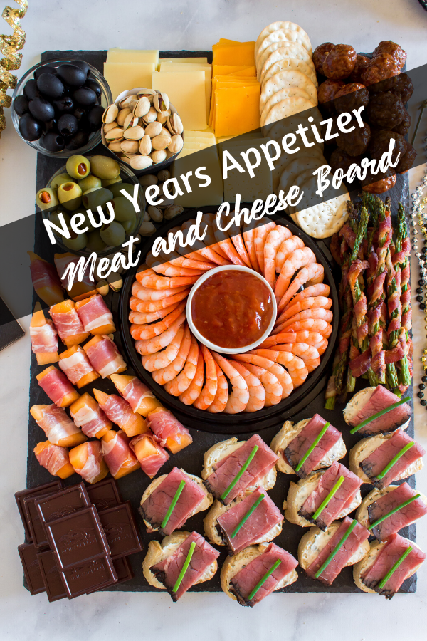 New Years Appetizer Meat and Cheese Board #appetizer #meatandcheese #fingerfoods #cheese #crackers #olives #shrimp #nuts # via @familyfresh